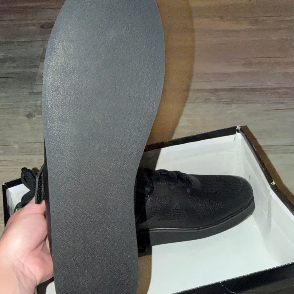 CCM Black High-Top Athletic Shoes with Silver Accents